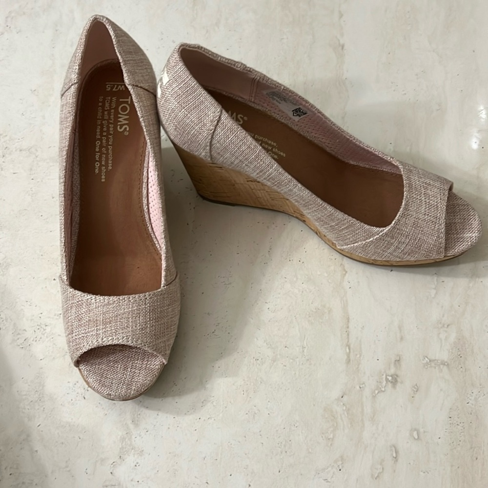 Toms  7.5 women’s light pink wedge heel with peep toe. New in box.